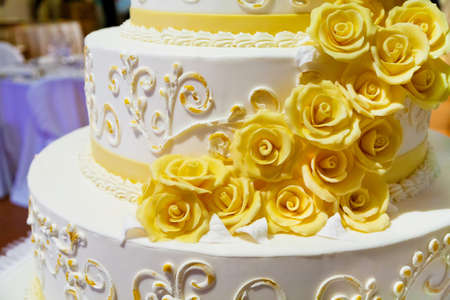 beautiful white nuptial cake with flowersの写真素材