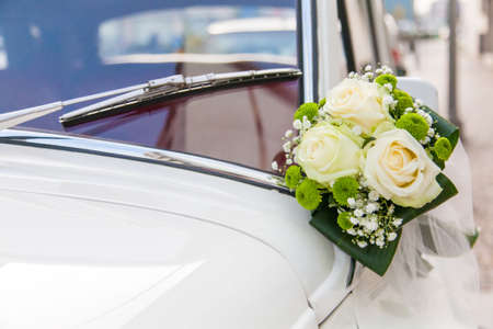 Luxury wedding white car decorated with flowersの写真素材