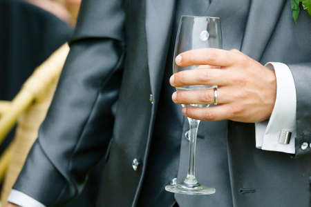 groom who drinks champagne the day of the weddingの写真素材