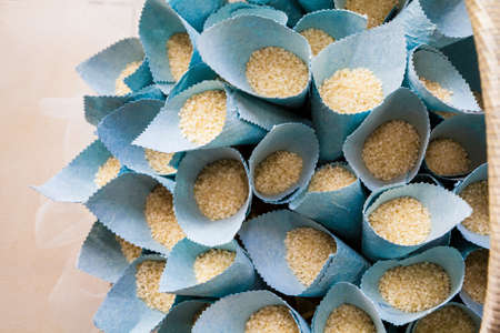 A basket of rice and petals of roses for the wedding