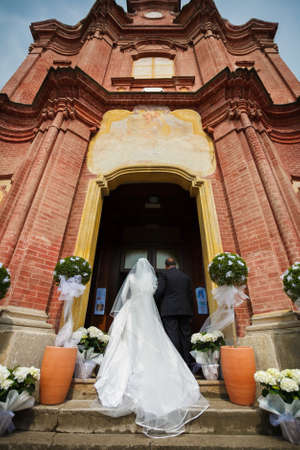 entrance of the spouse in church with the fatherの写真素材