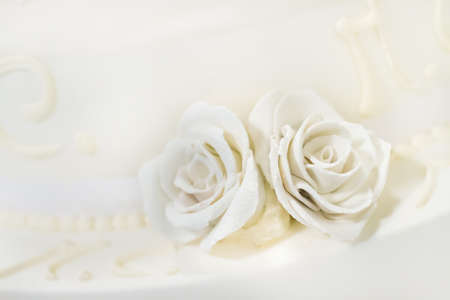 beautiful white nuptial cake with flowersの写真素材