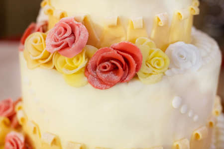 beautiful white nuptial cake with rosesの写真素材