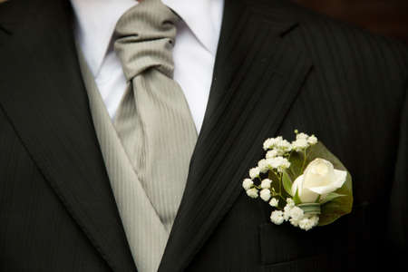 Groom in elegant black wedding dress