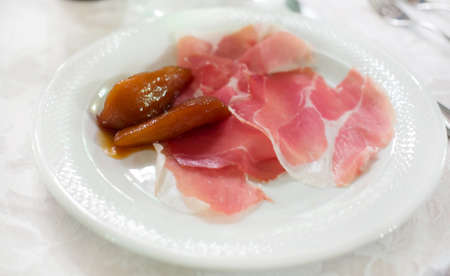 delicious plate of  ham sliced decorated with  caramelised pearsの写真素材