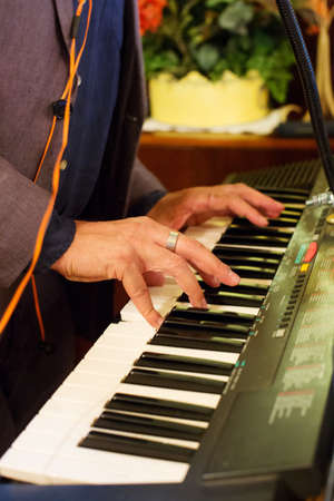 planist playing piano during the ceremony