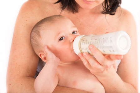 baby drinks milk from the baby bottleの写真素材