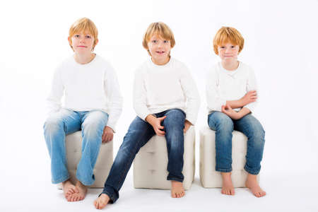 happy brothers on isolated white backgroundの写真素材