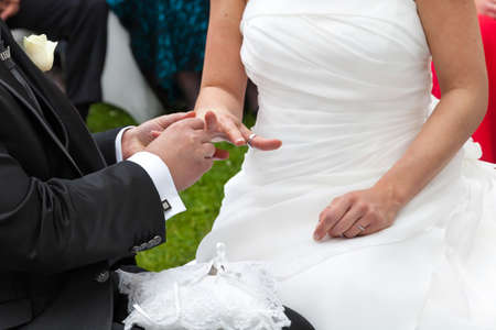 bride and groom hands with wedding ringsの写真素材