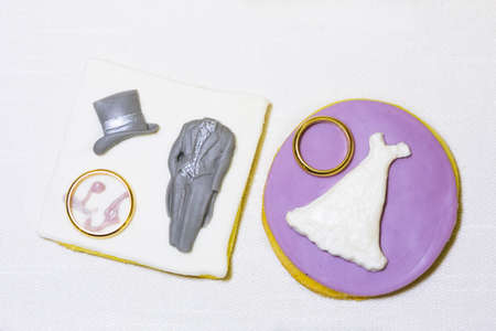 two platinum gold wedding rings on white backgroundの写真素材