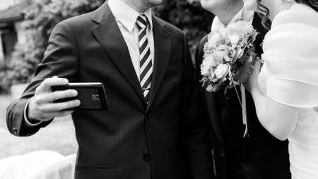 bride and groom selfieの写真素材