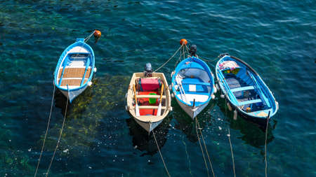 traditional fishing boats inside the harbor of Vernazza, Cinque Terre, Italyの写真素材