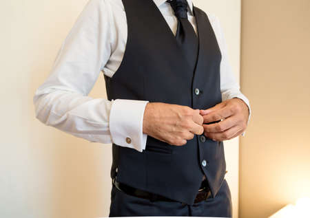 groom getting ready for a wedding day.の写真素材