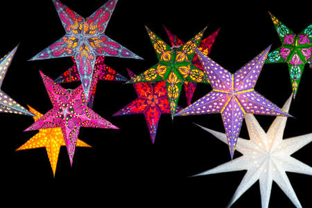 christmas stars decoration on black background in christmas market at Strasbourg