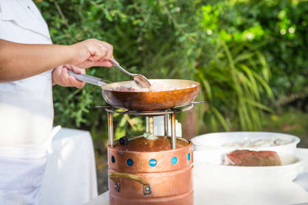 chef cooking meatの写真素材