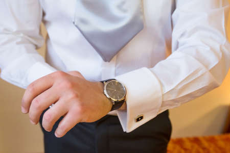 The man in the white shirt and cufflinks.の写真素材
