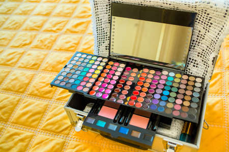 Make-up colorful eyeshadow palettes isolated on black backgroundの写真素材