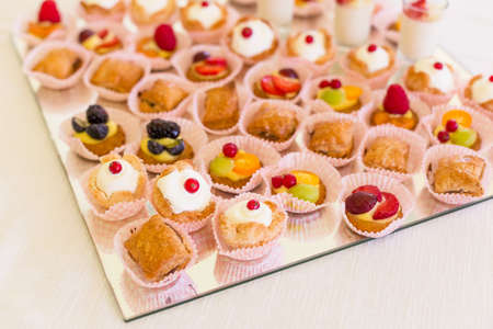 Delicious mini desserts with fresh berriesの写真素材
