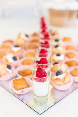 Delicious mini desserts with fresh berriesの写真素材
