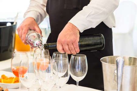 waiter serving champagneの写真素材