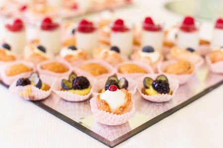Delicious mini desserts with fresh berriesの写真素材