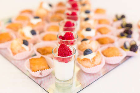 Delicious mini desserts with fresh berriesの写真素材