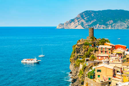 Panoramic view of ocean and harbor in colorful village Vernazza, Cinque Terre, Italy