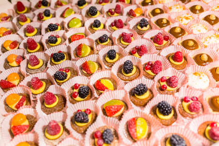 Delicious mini desserts with fresh berriesの写真素材