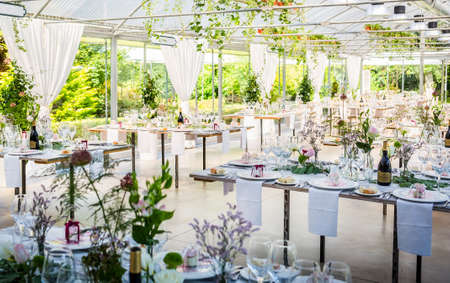 Tables decorated for a party or wedding receptionの写真素材