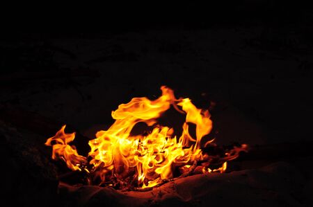 Fire burning over dark background