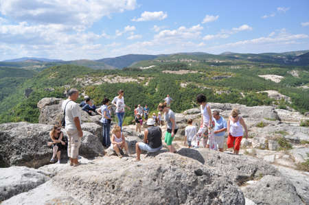 Tourists climbing the ruins of  ancient Thracian city of Perperikon, Bulgaria, summer 2010のeditorial素材