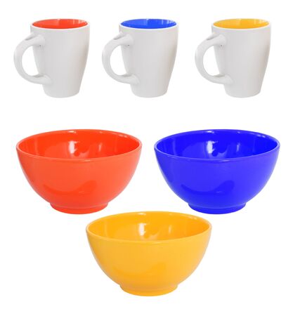 Three multicolored mugs and bowls, isolated on whiteの写真素材