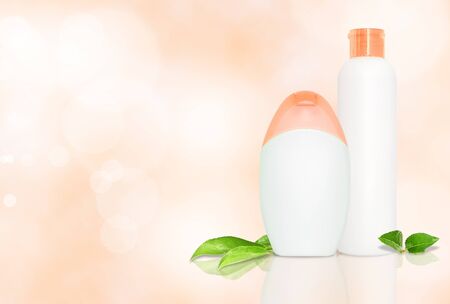 Set of two blank bottles for cometics on pink background with copyspaceの写真素材