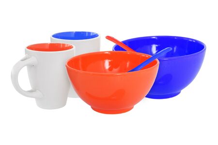 Breakfast set for two- mug, bowl, spoon in red and blue, isolated on whiteの写真素材