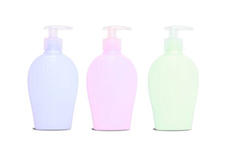 Three blank colorful bottles of soap dispencerの写真素材