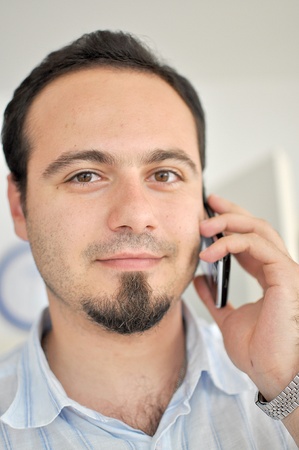 Young man talking on the phoneの写真素材
