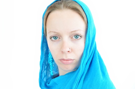 woman with turquoise earrings and scarfの写真素材