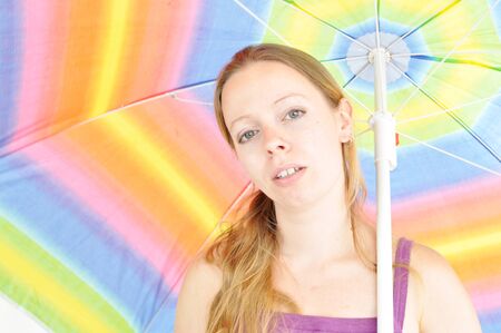 young woman holding summer umbrellaの写真素材