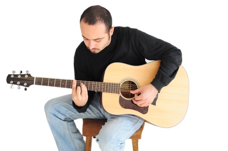 Young caucasian man playing the guitarの写真素材
