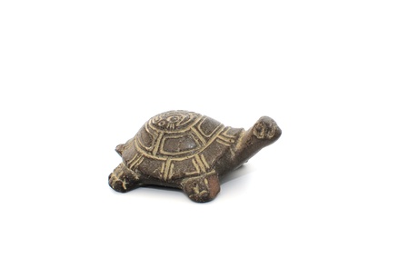 Souvenir turtle of stone on white backgroundの写真素材