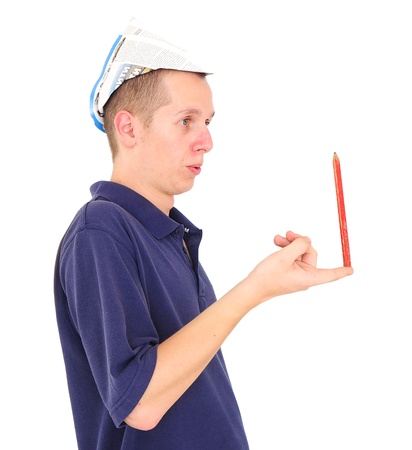 Young repairman playing balancing pencil on his fingerの写真素材