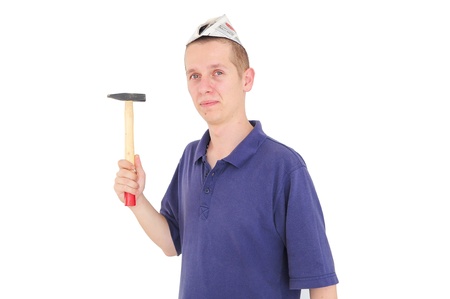 Young man with paper hat with hammerの写真素材