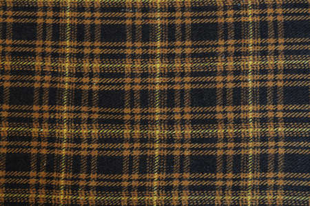 Black, yellow and brown wool plaid clothの写真素材