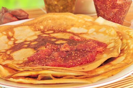 Breakfast of pancakes and fruit am on natural backgroundの写真素材