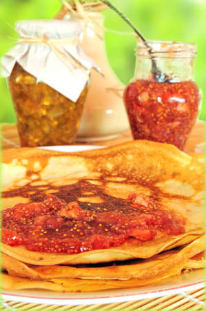 Breakfast of pancakes and fruit am on natural backgroundの写真素材