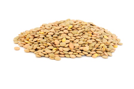 Pile of uncoocked lentils isolated on whiteの写真素材