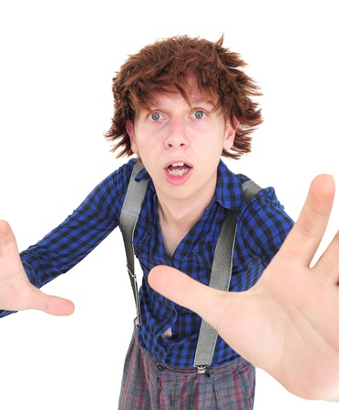 Man with funny hair and clothes reching to grab the cameraの写真素材