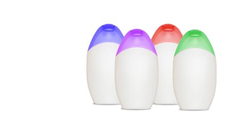 Set of four blank bottles for cometics on white with copyspaceの写真素材
