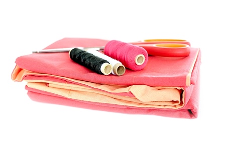 thread spools, scissors and clothの写真素材