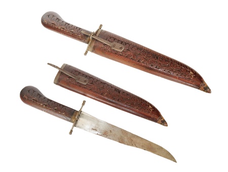 Old indian dagger with wooden engraved hilt and sheathの写真素材
